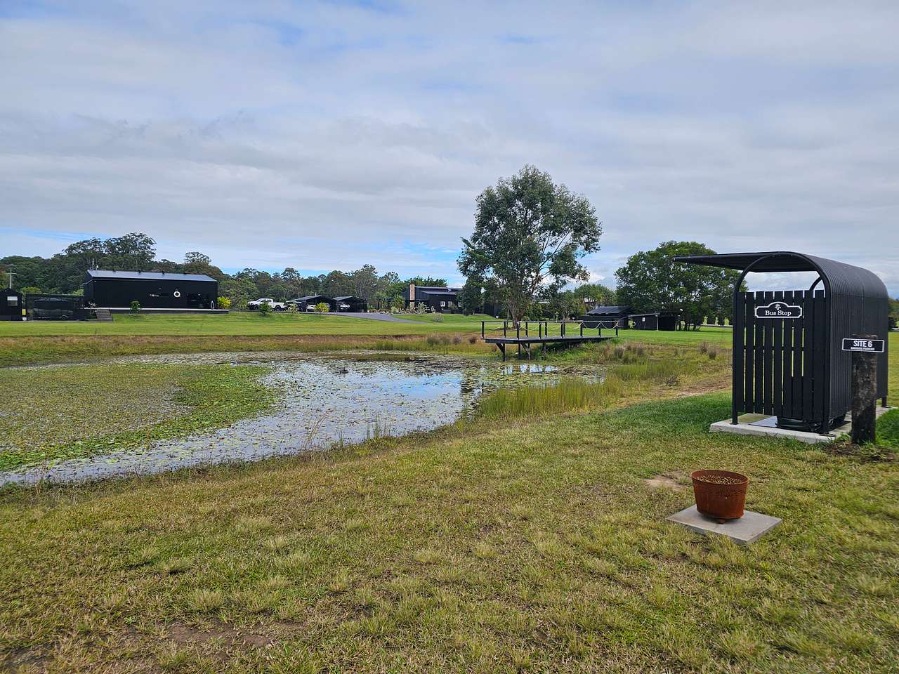 Site 6 is set on the dam. This is an unpowered site. It is situated next to the bus stop where firewood is stored for campers to purchase should they forget to bring firewood of their own. All sites have an onsite brazier for use during your stay. 