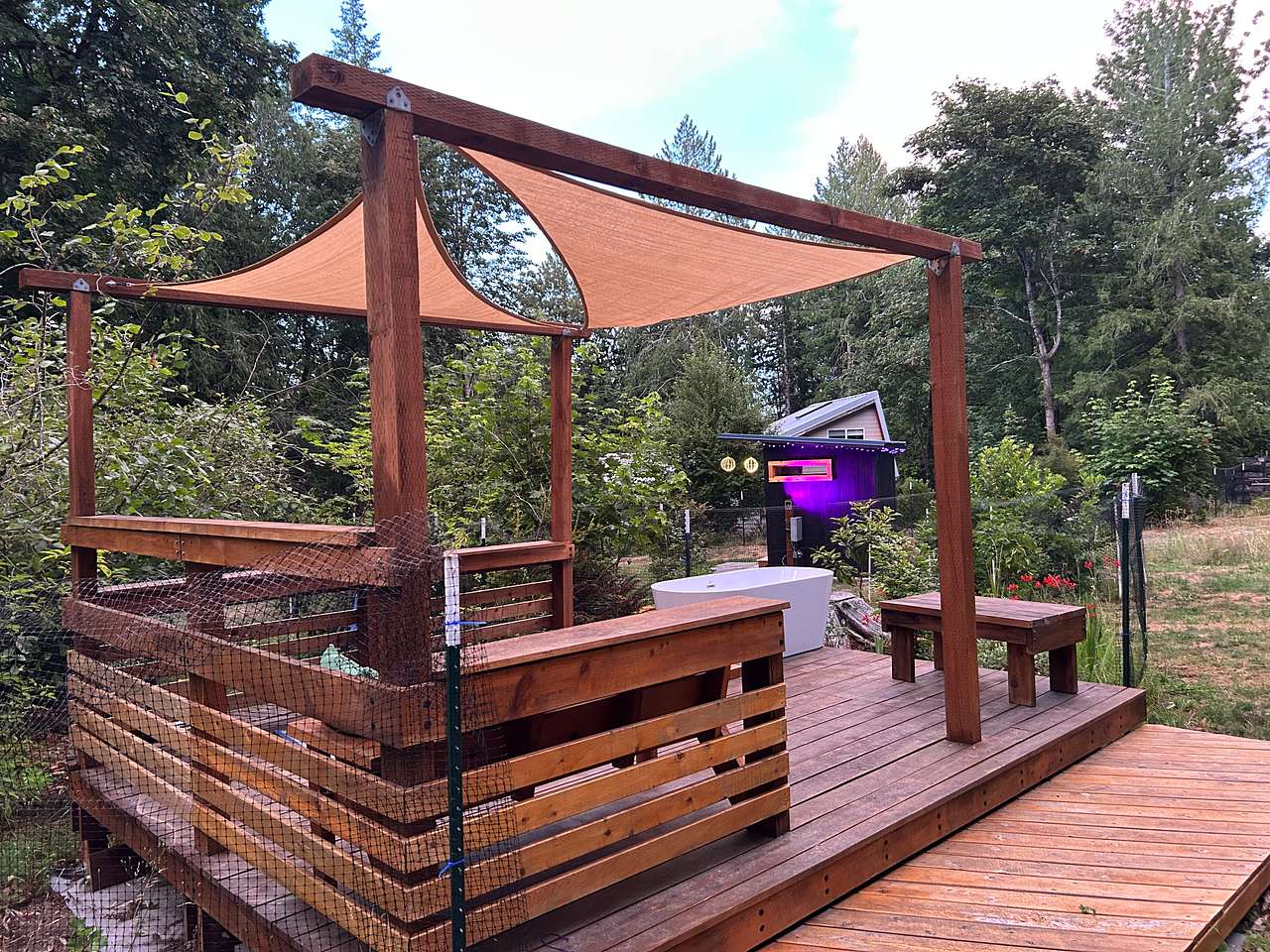 Olalla Sauna sundeck at the Cedar and Strawberry Hipcamp makes for an enjoyable retreat space day or night.