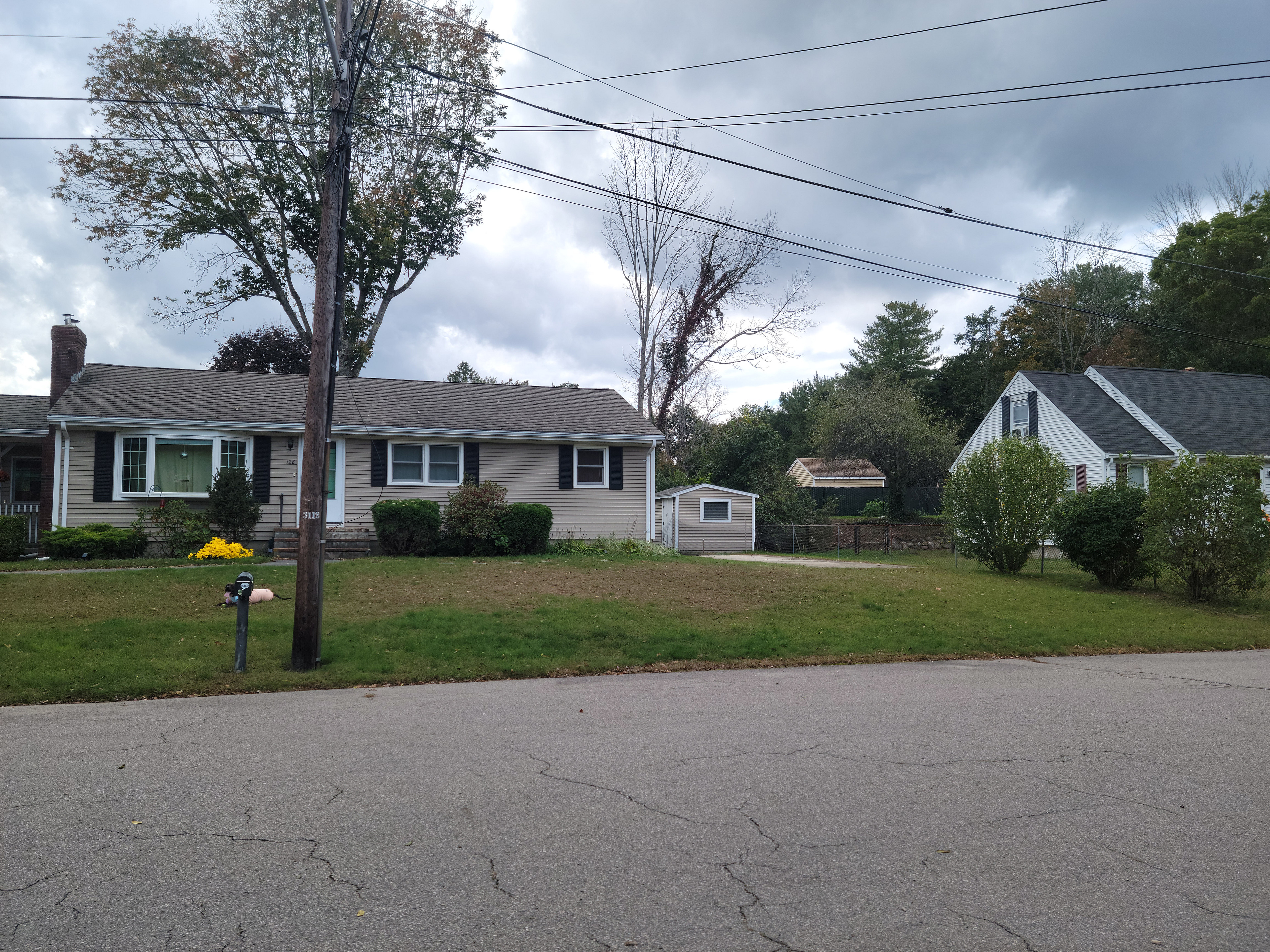 Front of the house with the RV pad on the right side.
