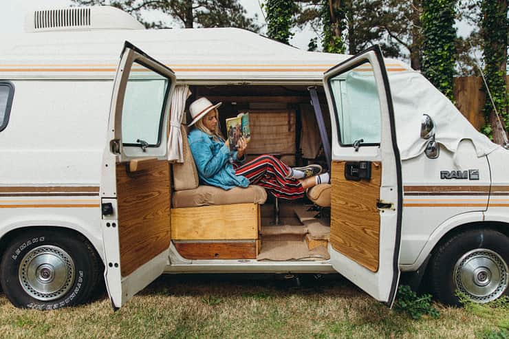 host-reading-in-van