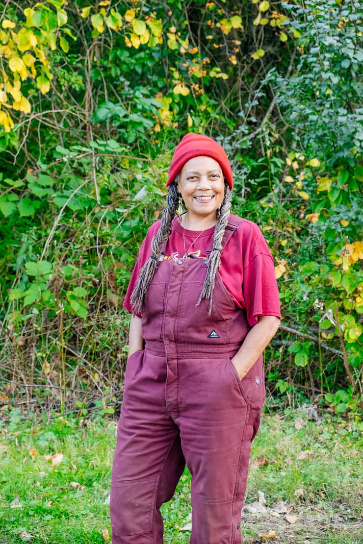 host-smiling-in-overalls