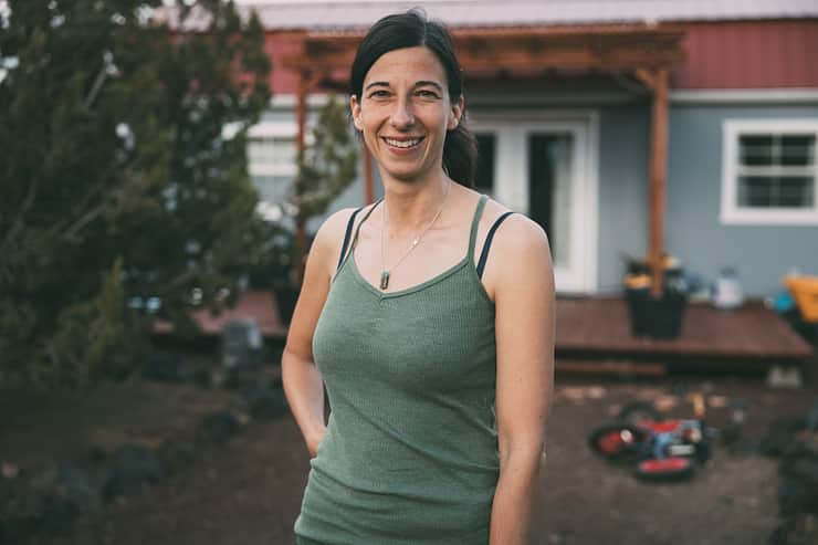 host-smiling-outside-home