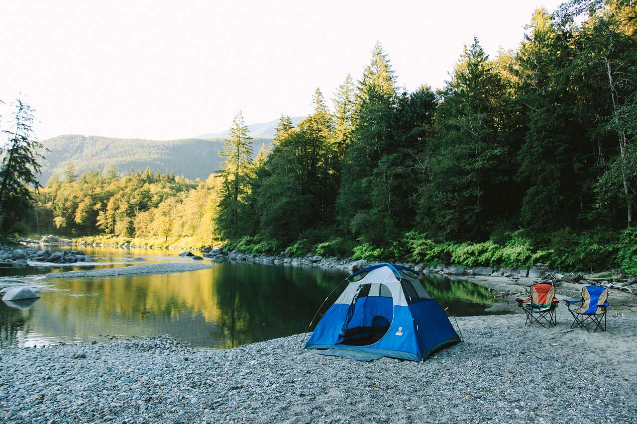 If you pitch your tent down on the landing you can see the sunset looking north over a mellow eddy in the river.