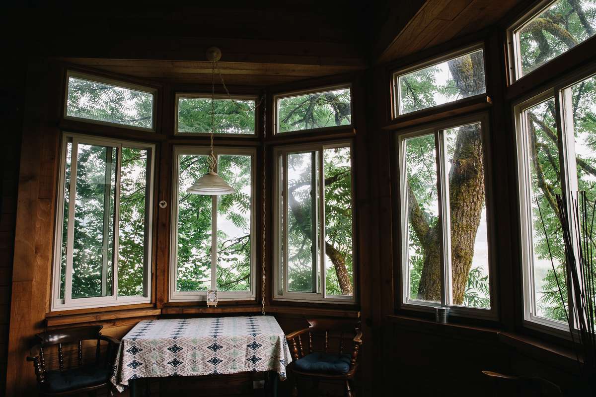 The surrounding trees hug the cabin making it feel as though you're in a tree house