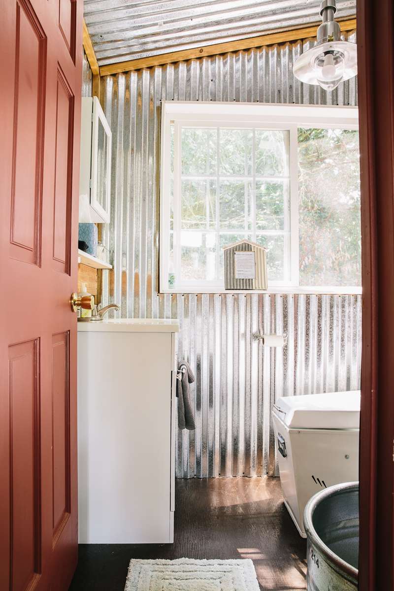 The adorable bathroom complete with an incinerator toilet, a trough shower, and perfect details.