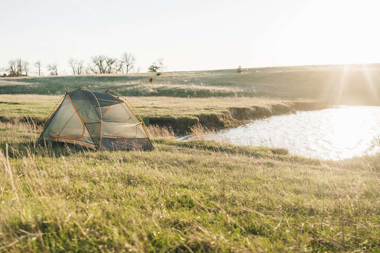 Putting the tent by the little pond was good against the wind.