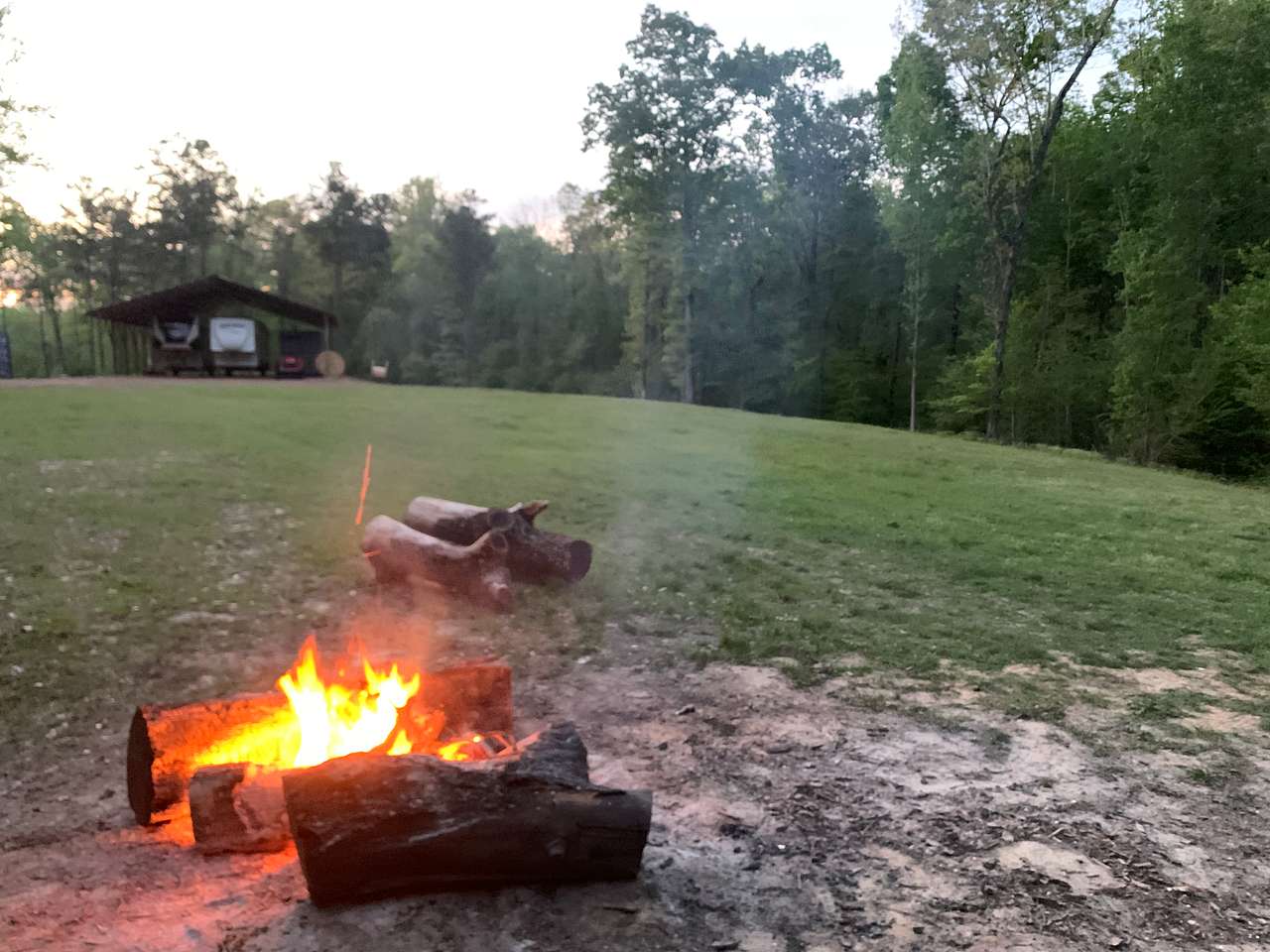 This spot is not numbered. It is closer to the house and is where we entertain friends with larger bonfires. It has power to it and can have a water hose easily stretched to it. If you want to camp here just let me know when you book. 