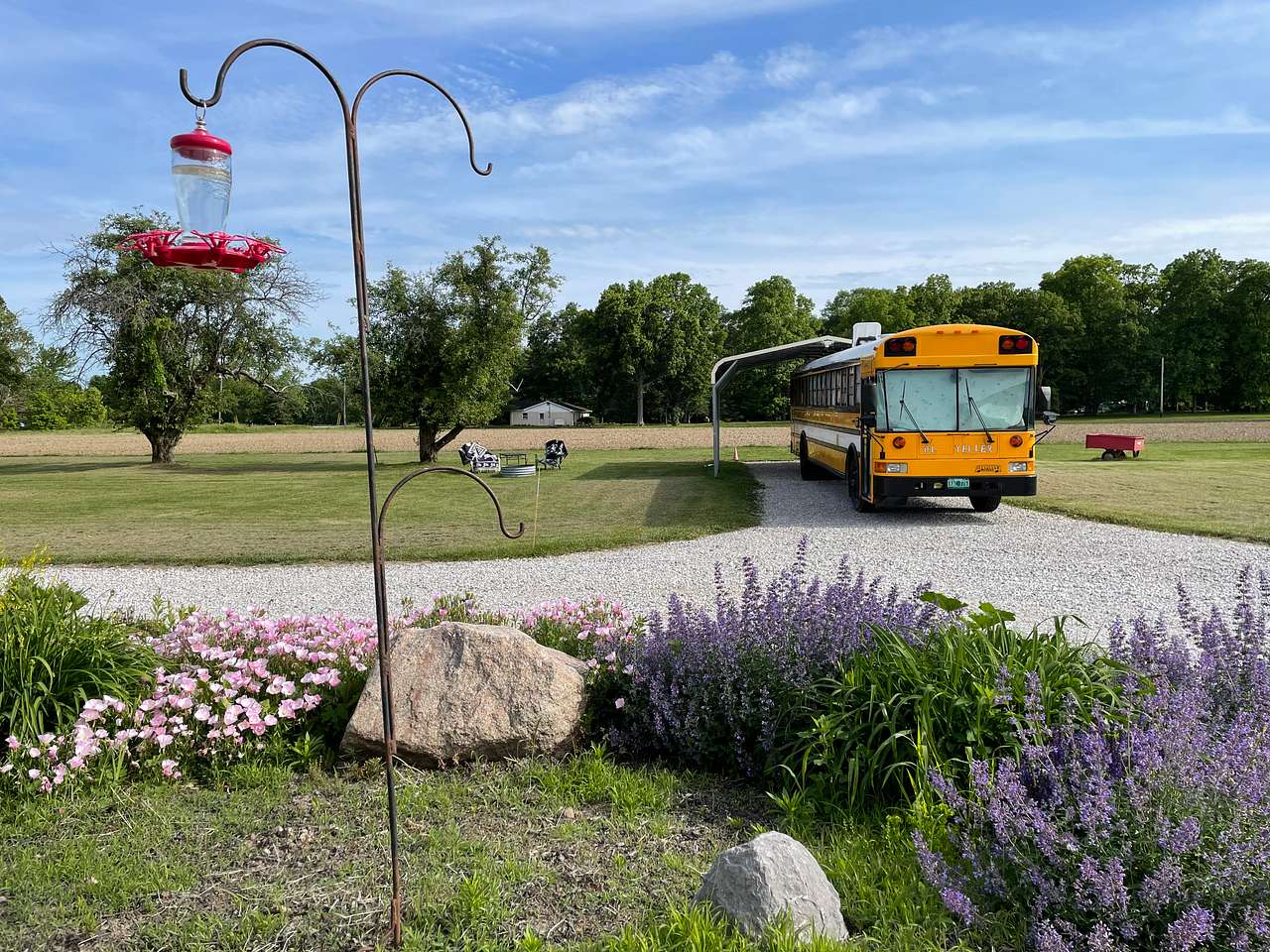 Tall enough carport for a school bus! Next to our floor garden, amongst the hummingbirds. 