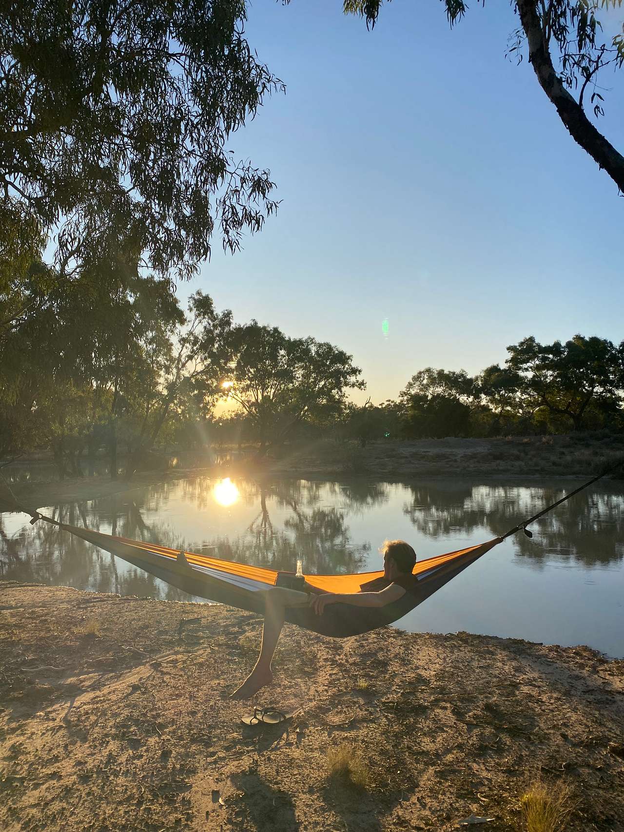 Campers relaxing watching the sunset 