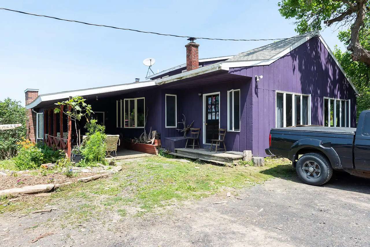 This is The Purple Palace, which is above the Mountain View Suite. Mountain View Suite guests park in front of the right side of the house, next to the big mulberry tree.