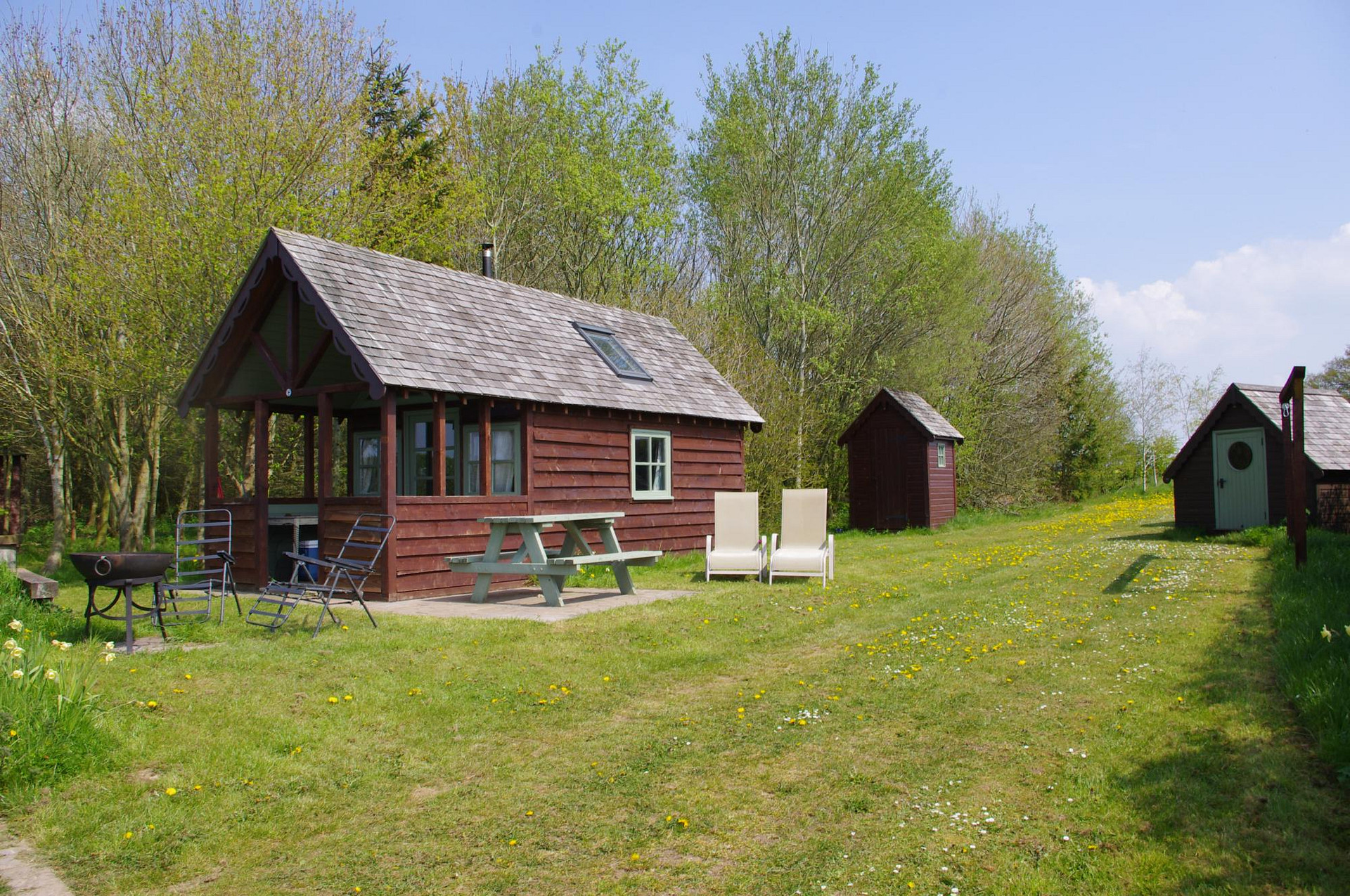 The Billy Goat Cabin at Broadmeadow Farm.  Off grid, composting toilet, beautiful sunset views, cosy log burner, indoor heated swimming pool available