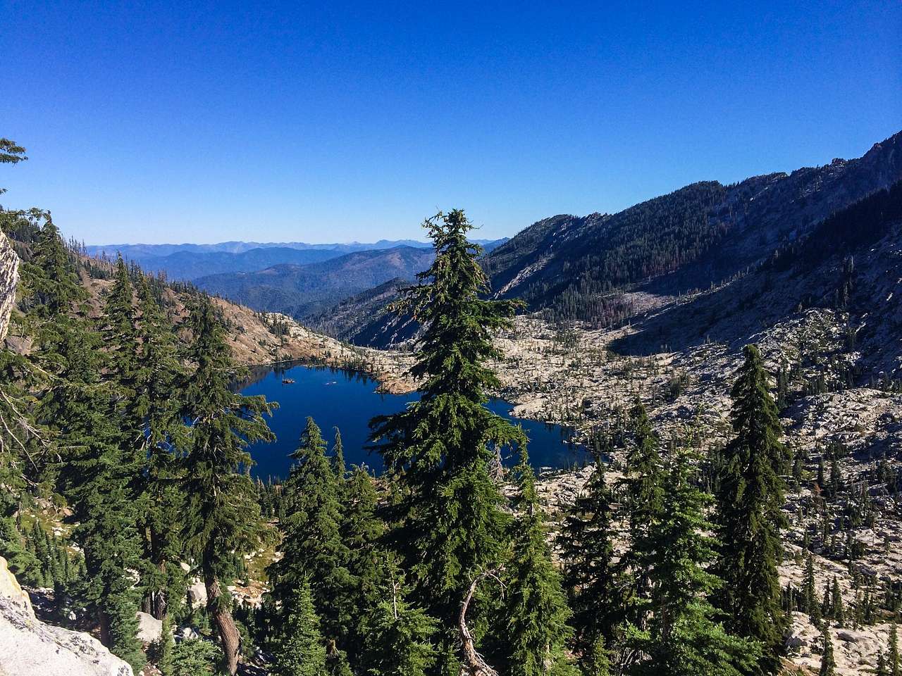 From Big Flat, a few mile hike will take you to Caribou Lake. Big Flat itself has plenty of space for car and tent camping with a stream running next to it. There is plenty of shady spots available. Many hiking trails start here. 