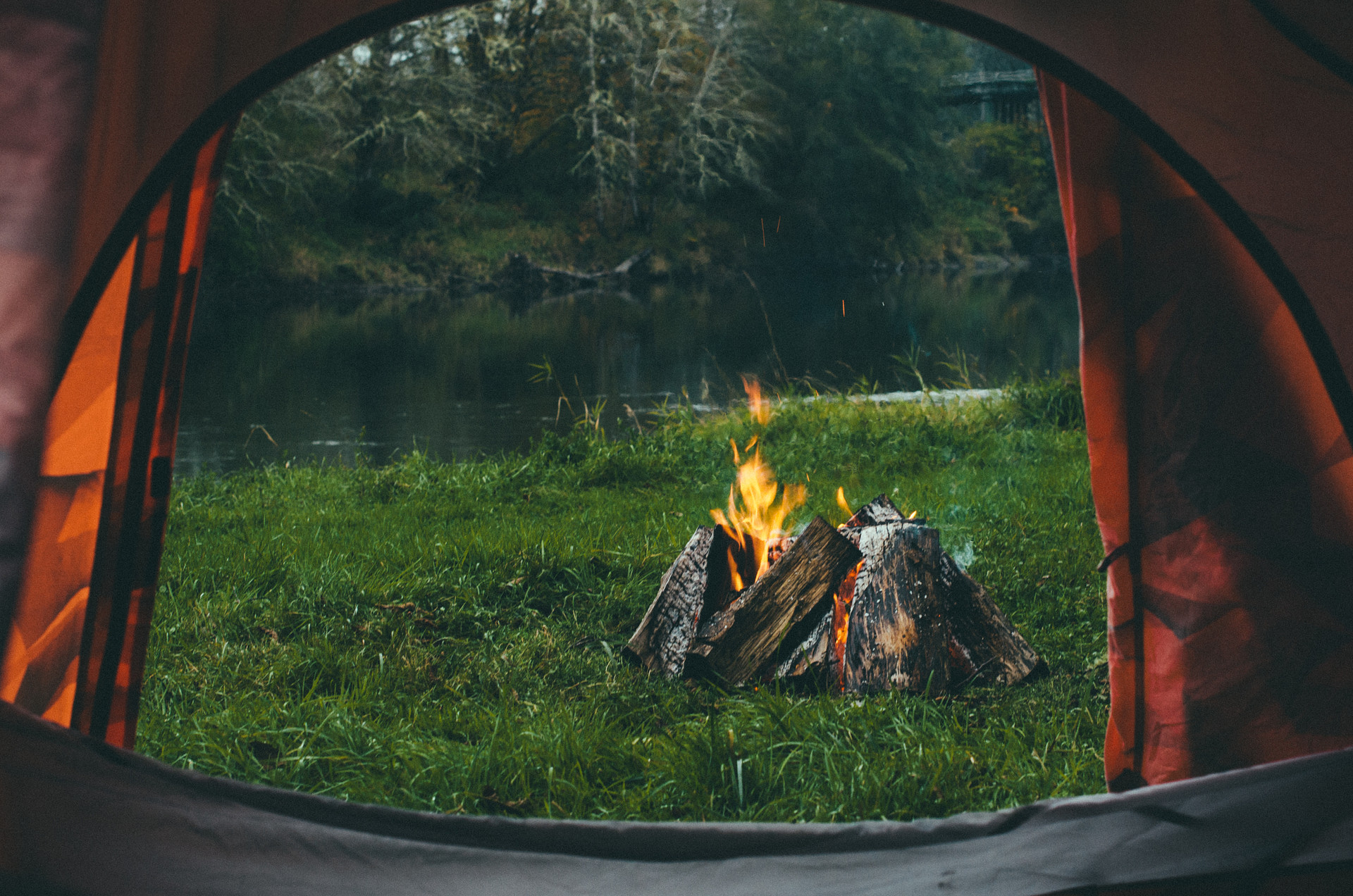 Camp vibes. Enjoying the fire from inside my tent to get out of the rain. 