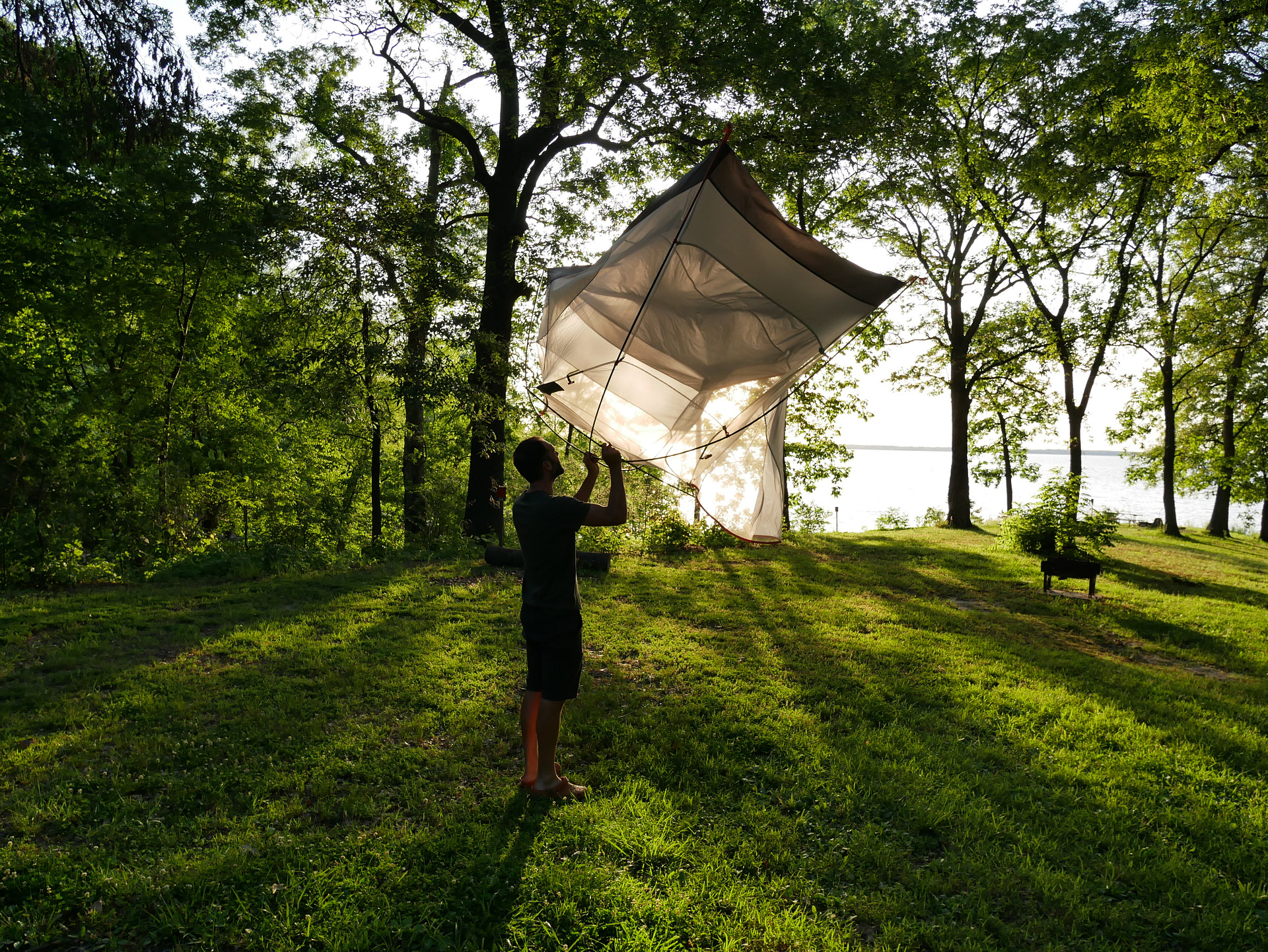 Shaking out the tent in the morning glow.