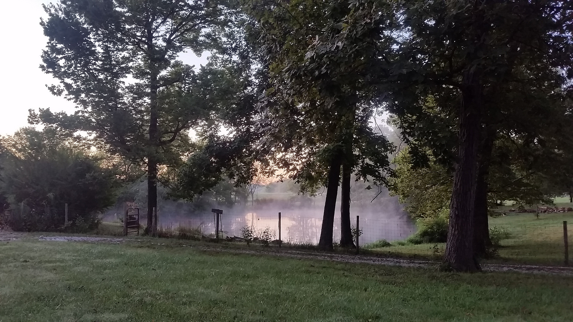 Places to camp in shade around pond provides a beautiful picturesque backdrop for the sunrise. 