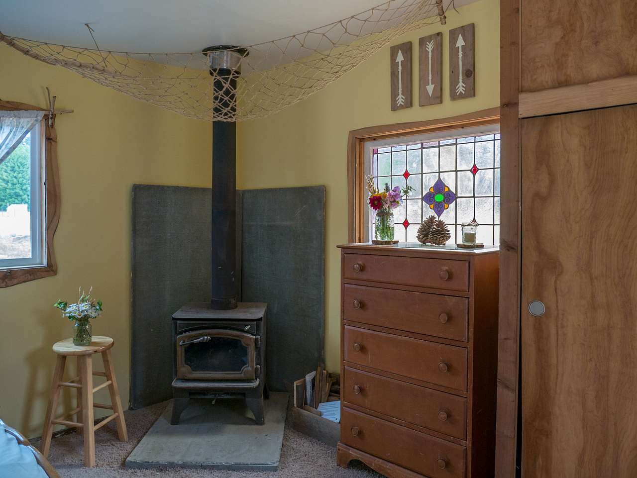 Cozy wood stove for chilly nights, drawer and closet for your belongings.