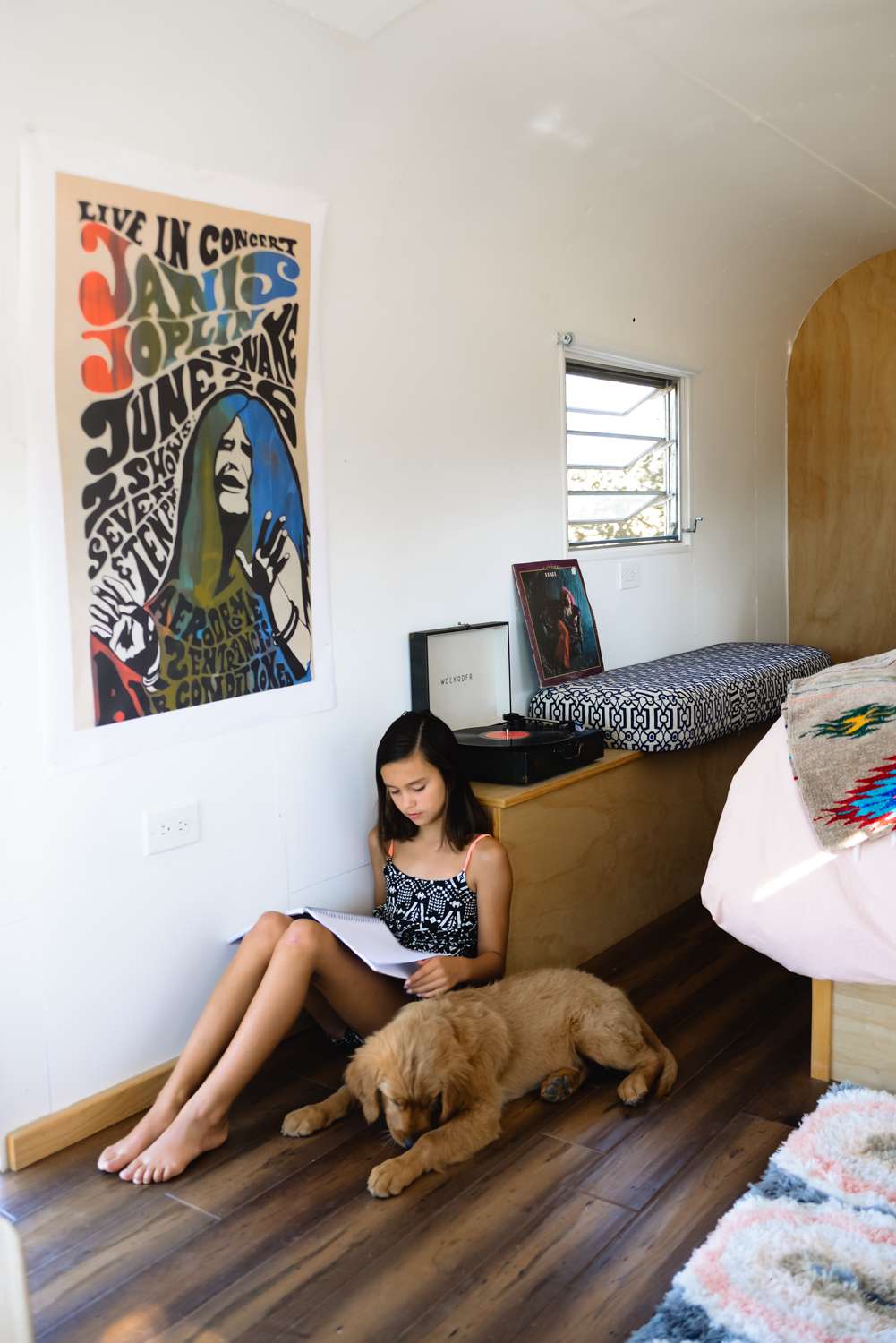 My girl and her pup in a cozy little nook of the trailer 