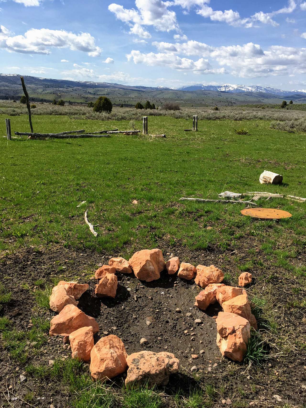 View looking west by the large fire pit area.  Plenty of wood logs for seats if you don't bring your own!