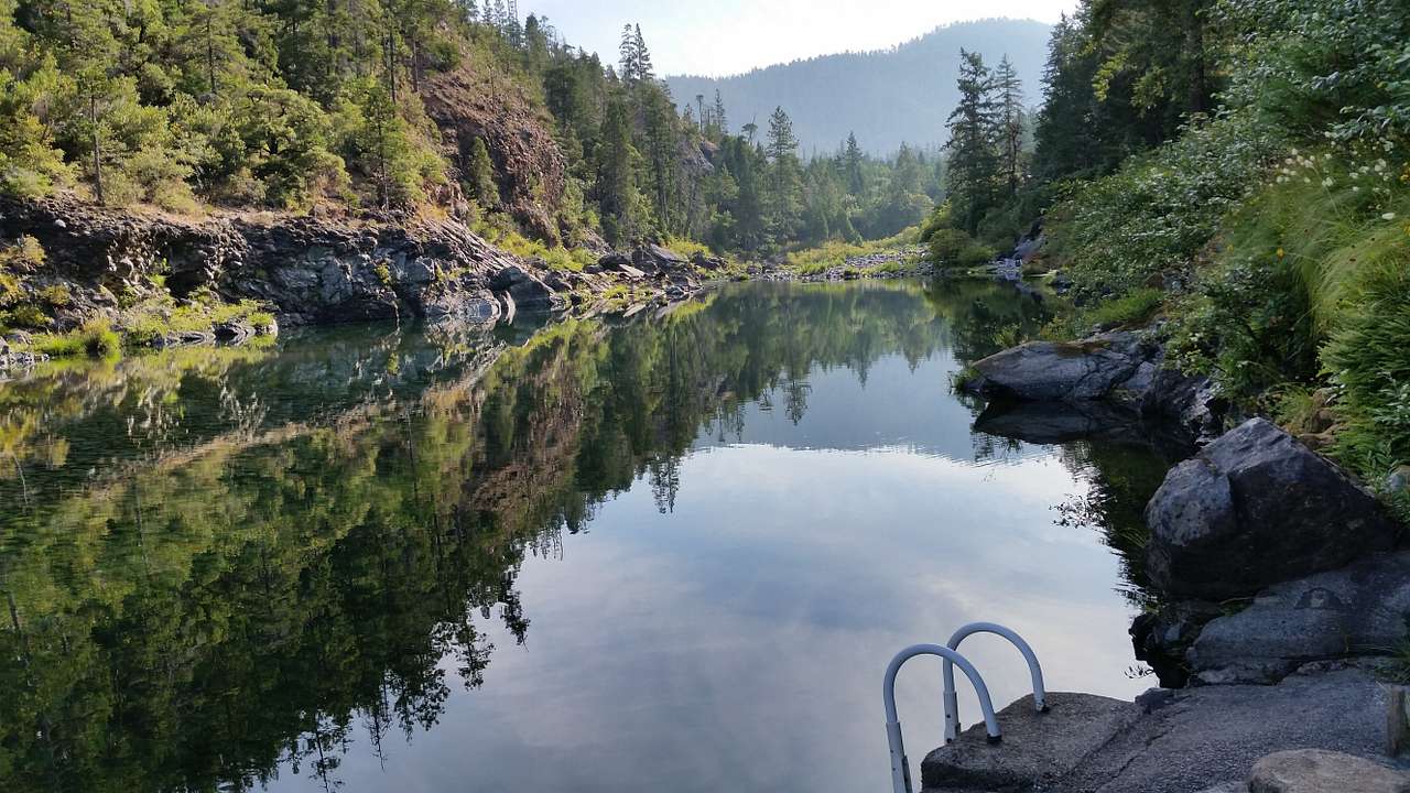 Swimming hole with ladder into the water.