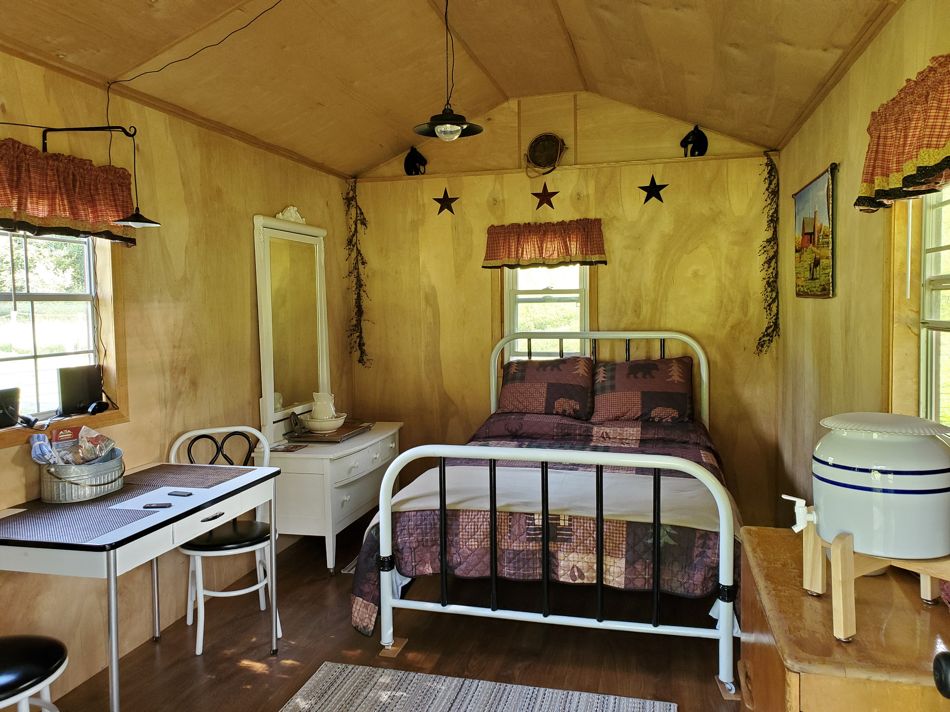 Inside view of Bed, dresser and table