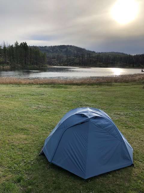 The soft grass and proximity to the lake makes for a beautiful camp experience.