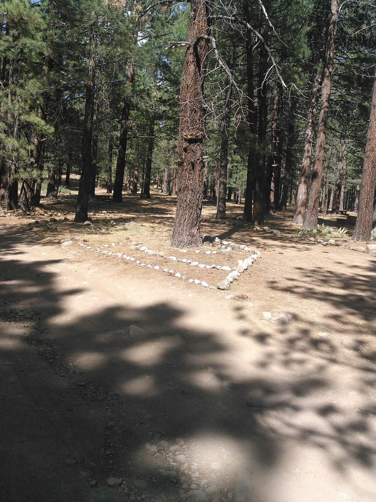 Camp Host Andrew Blash refurbished the camp and made rock designs 