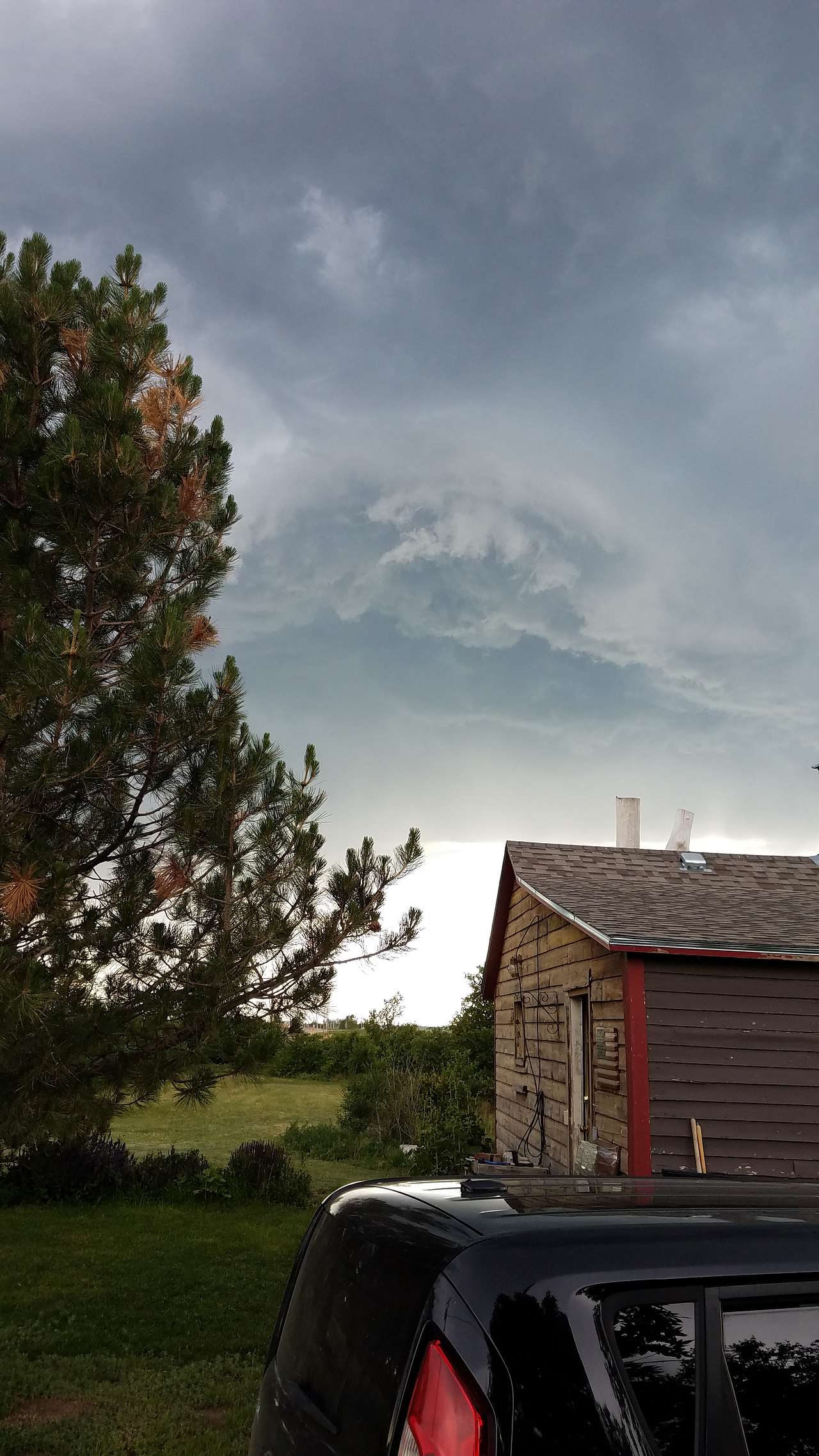 Clouds rolling in over the cabin.
