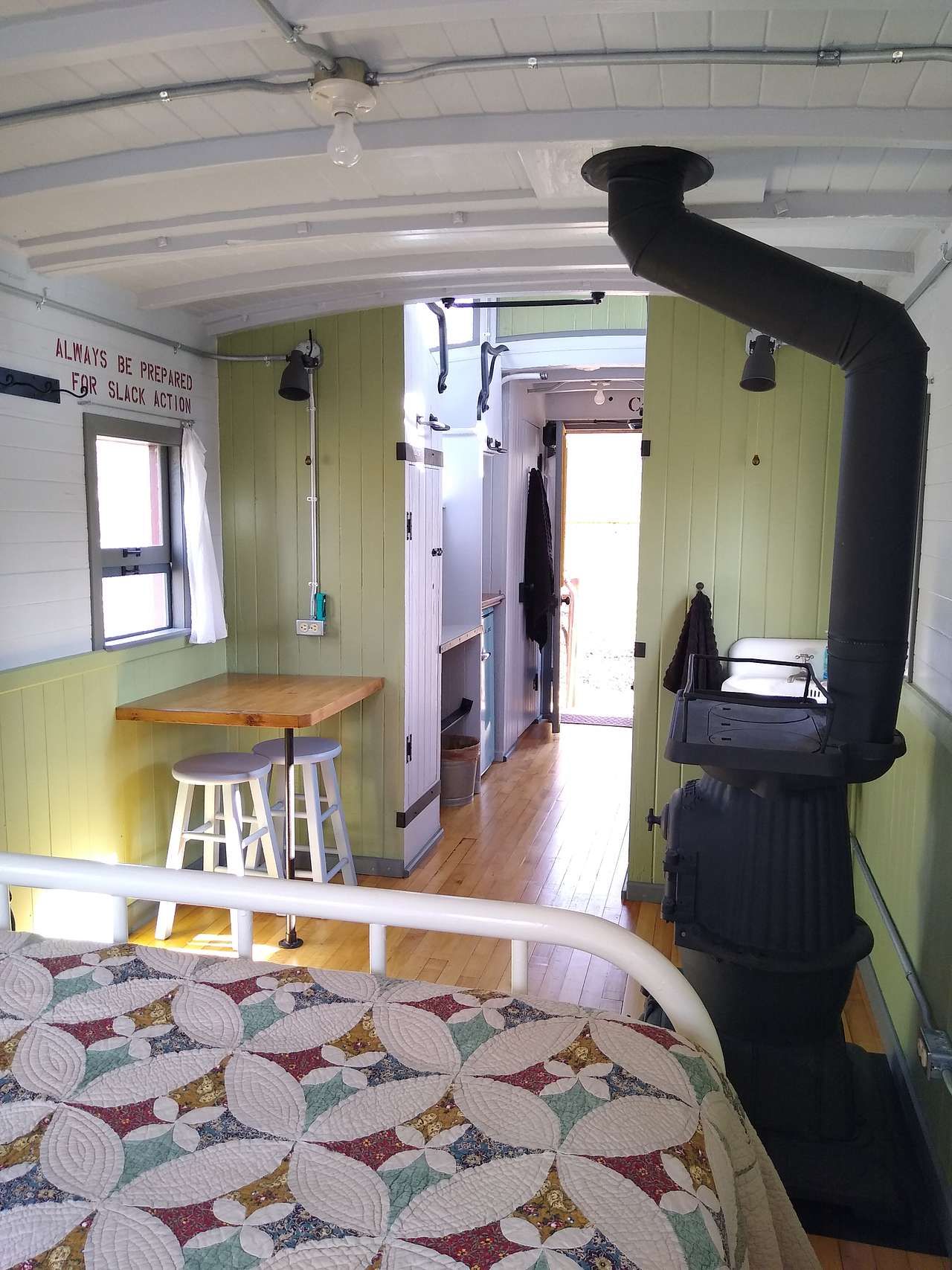 From the bed toward the door.  The shower is at the end of the hall on the right, just inside the doorway