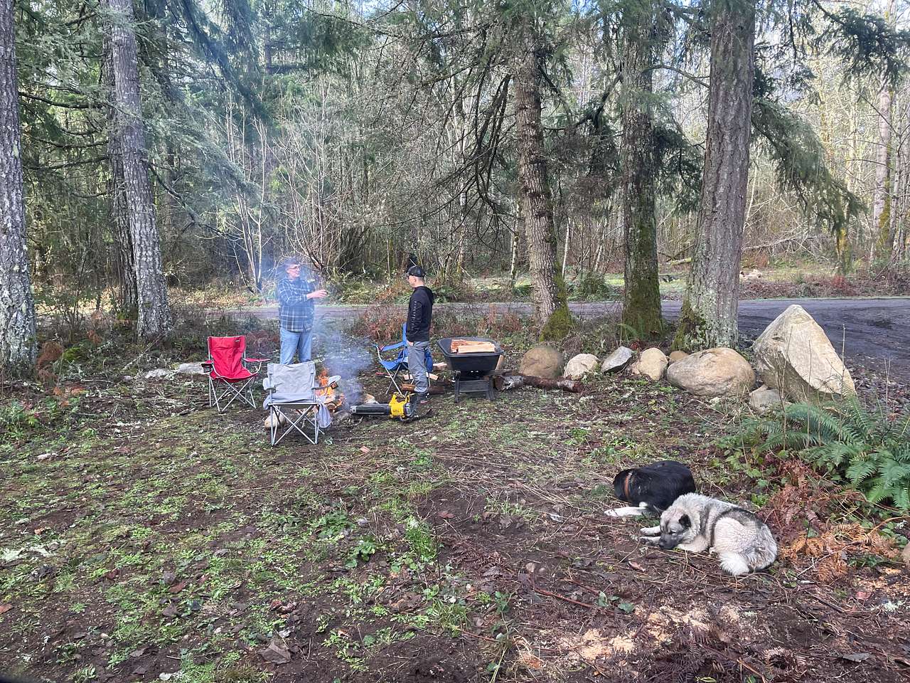 Dean (left) with my husband standing around the fire conversation. Zoey and Jake hanging out waiting for their dad to finish talking.