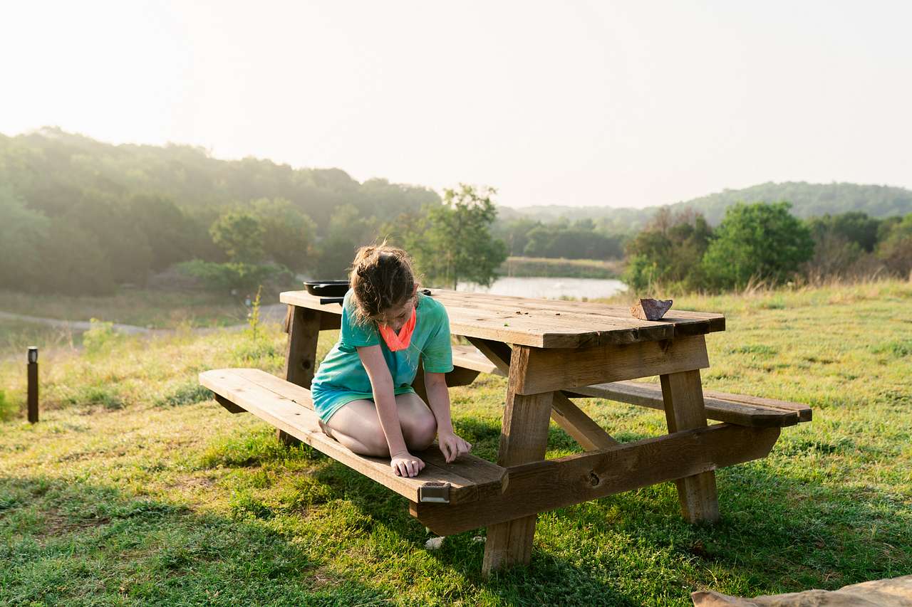 Big, sturdy, clean picnic table is big enough to spread out.