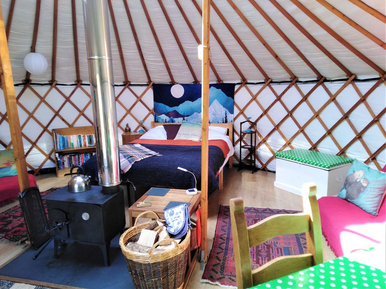 Luxury yurts with all bed linen provided, toys, books, cooking equipment and a great little log burning aga to cook on indoors. 