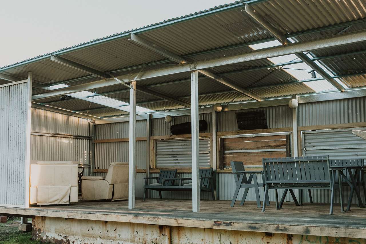 The shed where you can relax, sit around the table, enjoy a fire, play some darts...