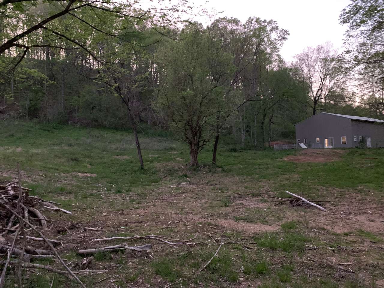 Middle of property, view of main house from camping and platform area.