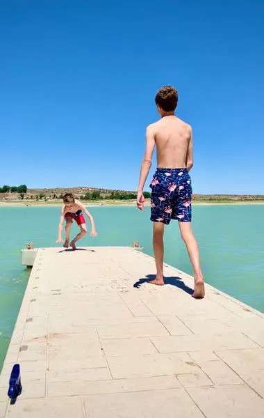 Note: dock located at shared private beach lake access 1.25 mi drive or walk from camp site.