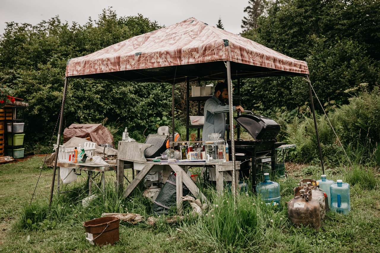 the cooking tent has everything you need! water, cutlery, bbq, fuel, a cover incase of rain, and space for a couple humans