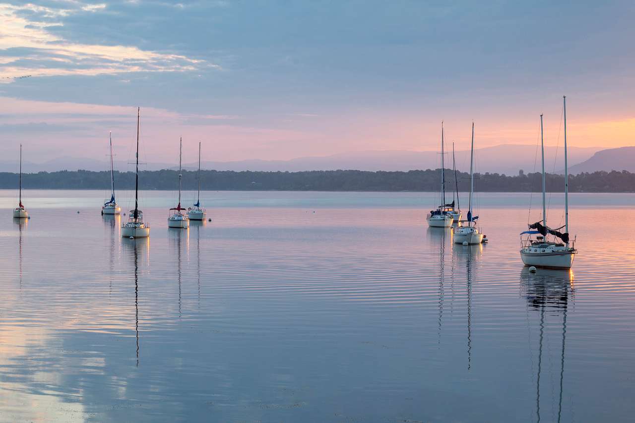 Bridgeview Harbour Marina Lakefront View of sailboats on Lake Champlain at sunrise