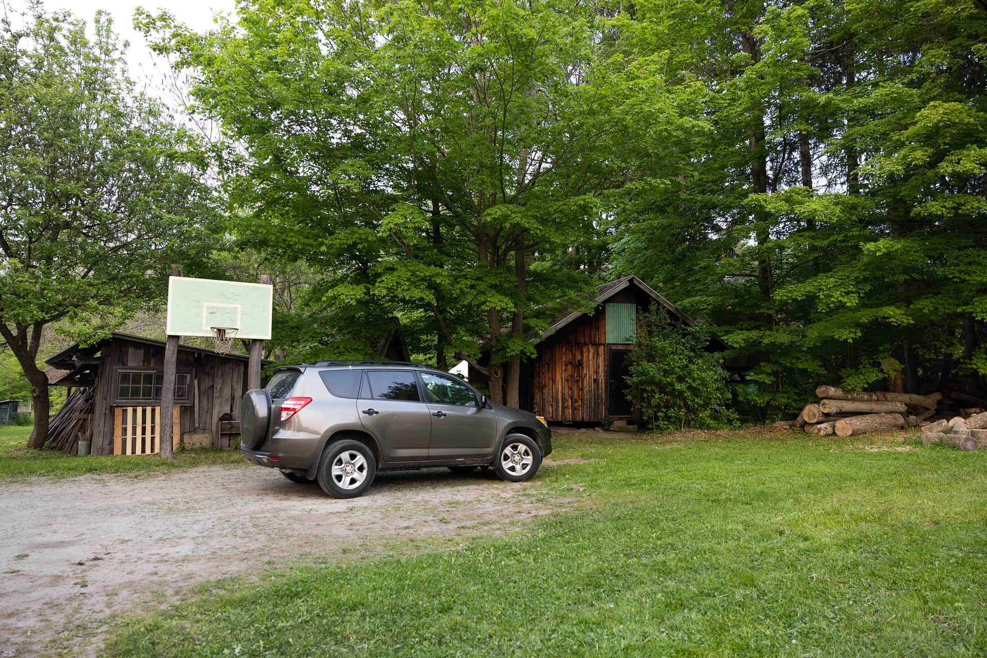 view of the cabin and parking area (also visible from the road)