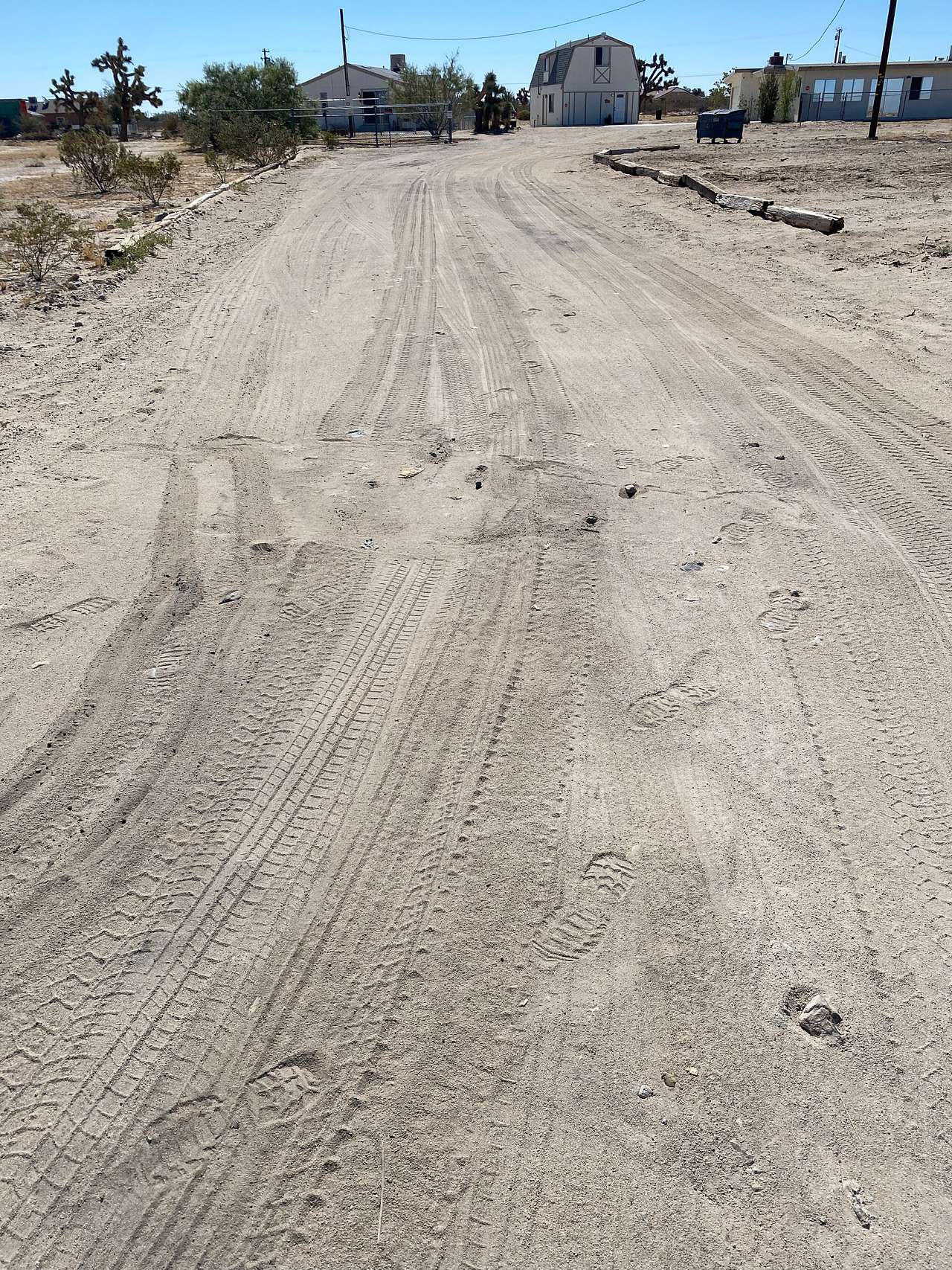 Driveway to the RV Hook-up. You may drive to the left or right of the Cozy Corral barn, but please do not block any driveways or garage doors. Thanks