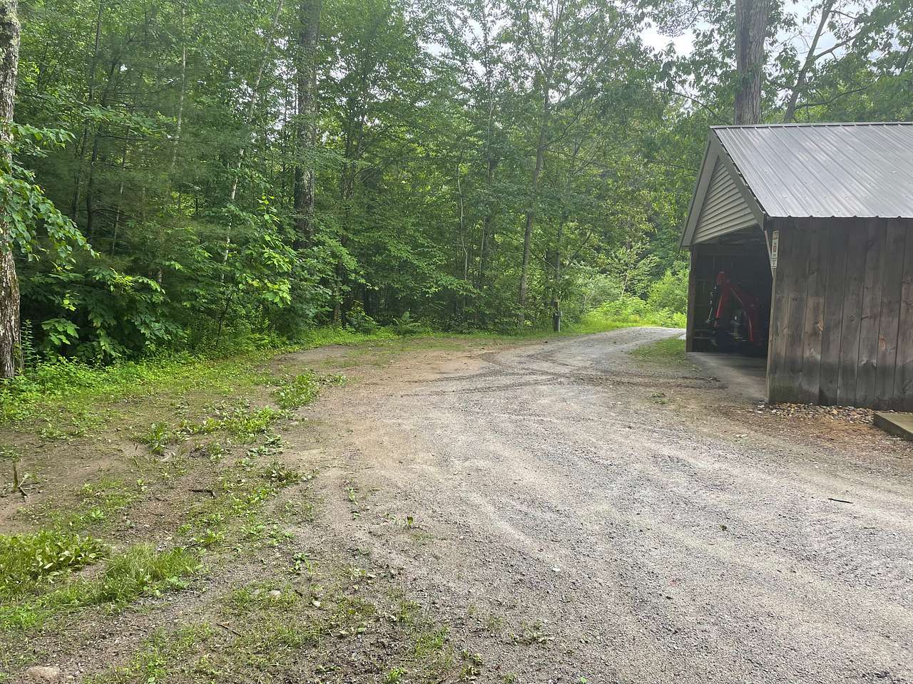 Rv pad #1 what it looks like empty. will accommodate up to a 35ft camper. Nice quiet spot back of the property.