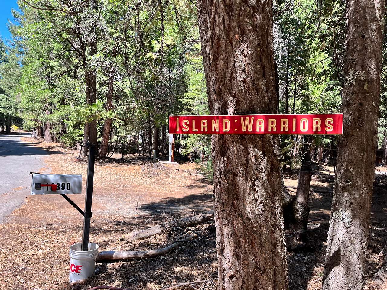 Property will be in your right side. Look for the Island Warrior sign on the tree at 10390 Ritts Mill Road. Turn into the driveway. Make a left in front of the cabin and continue to your campsite past the shed.