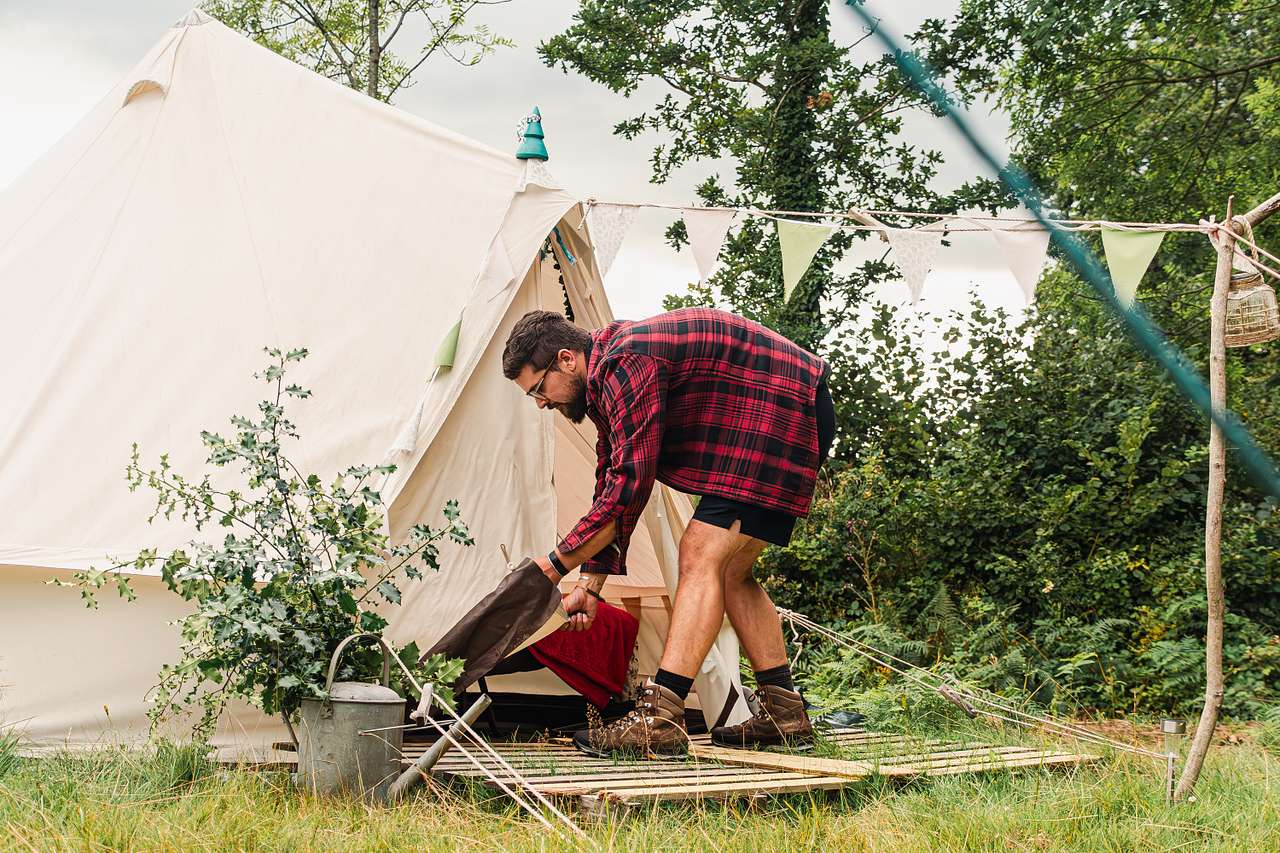 Rolling up the tent entrance on Holly Bush