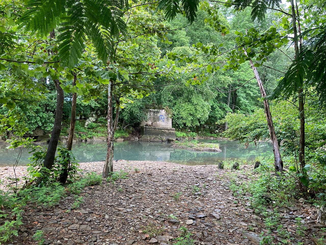 Remains of old railroad bridge below the main bridge on the highway coming into town.