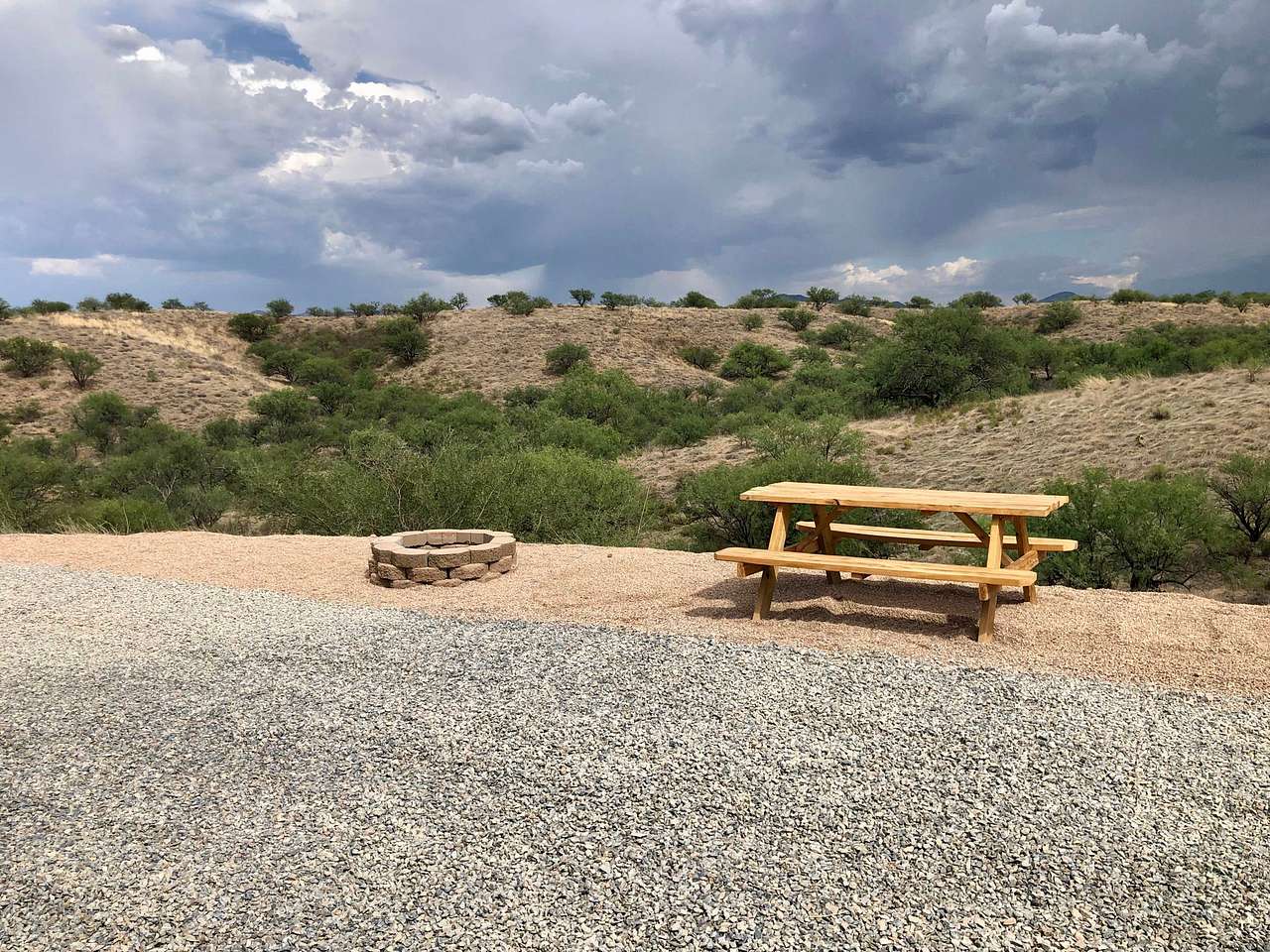 View from RV site with fire pit and picnic table 