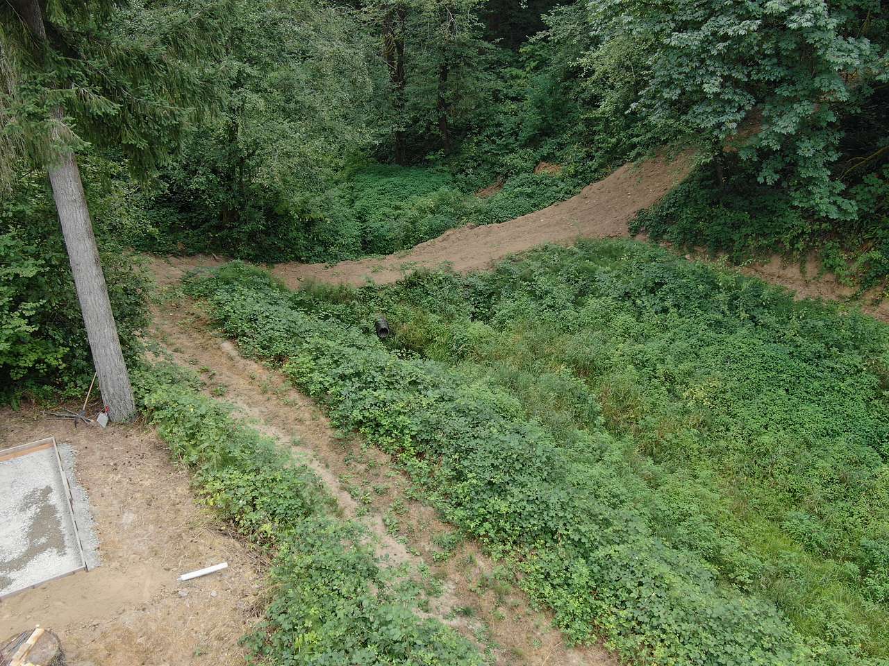 There is a trail to the other side of the pond. You can hike up to the top on the far side if you want a secluded, private site.