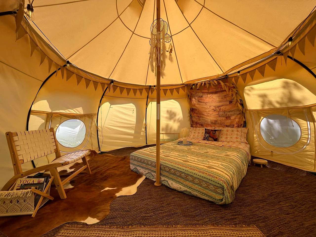 Enjoy a comfortable queen sized bed, reading area w/ books, electric fan, USB ports and free Wifi