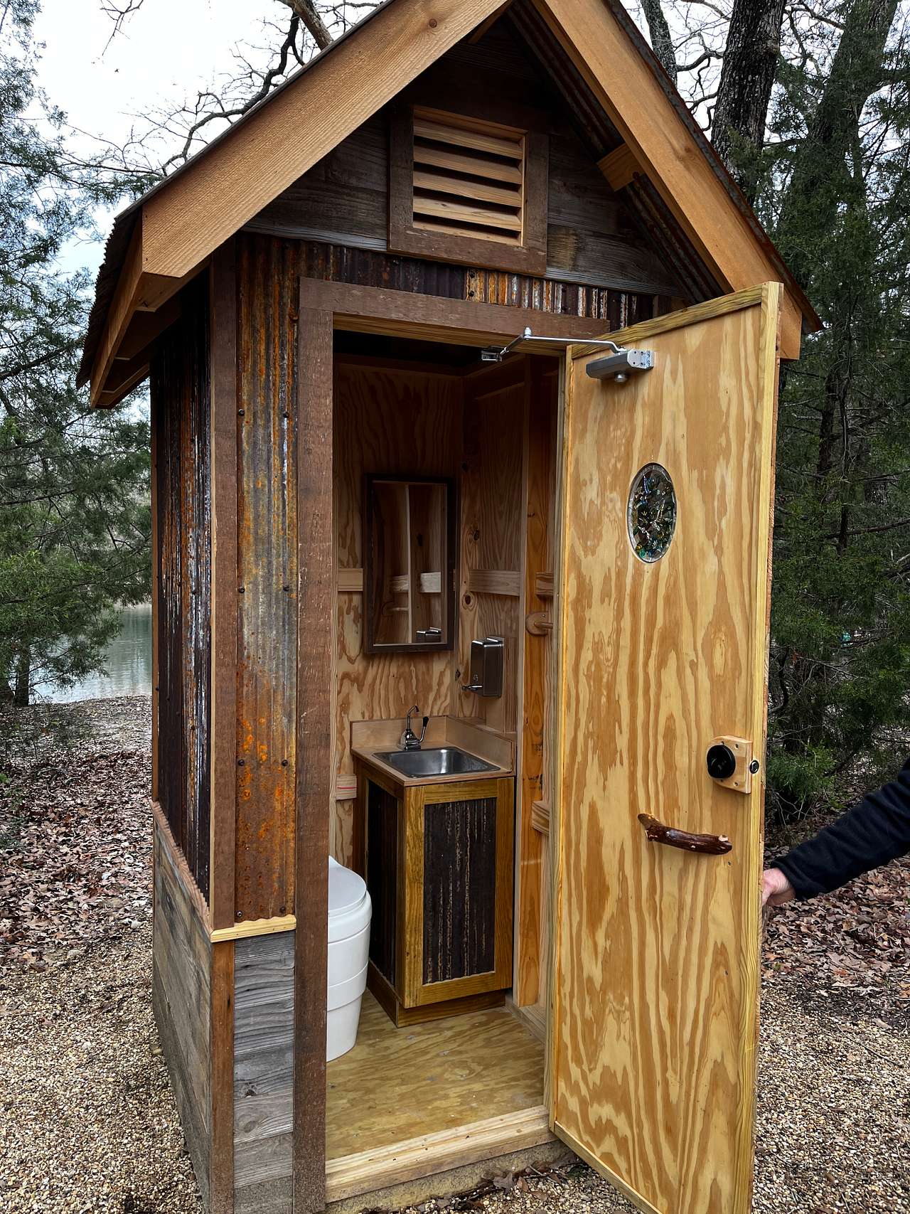 Ventilated, composting toilet, hand washing sink with soap and towel 