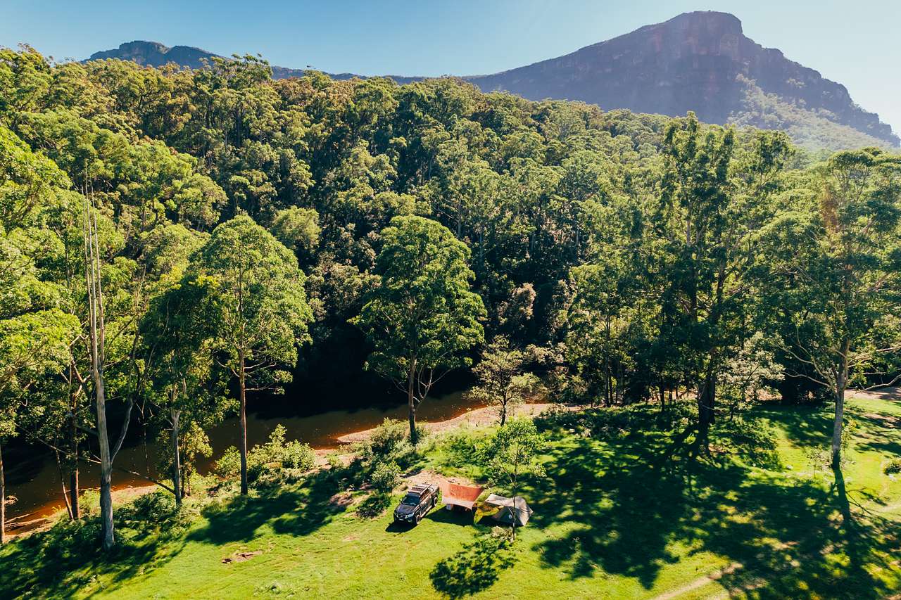 Campground aerial views with mountain walls in the background