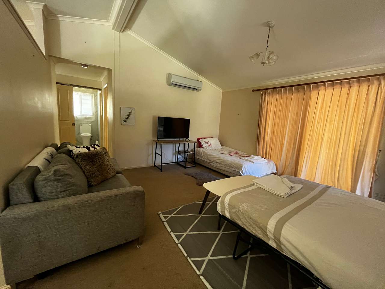 Open plan lounge room, Double Bed and King Single. 