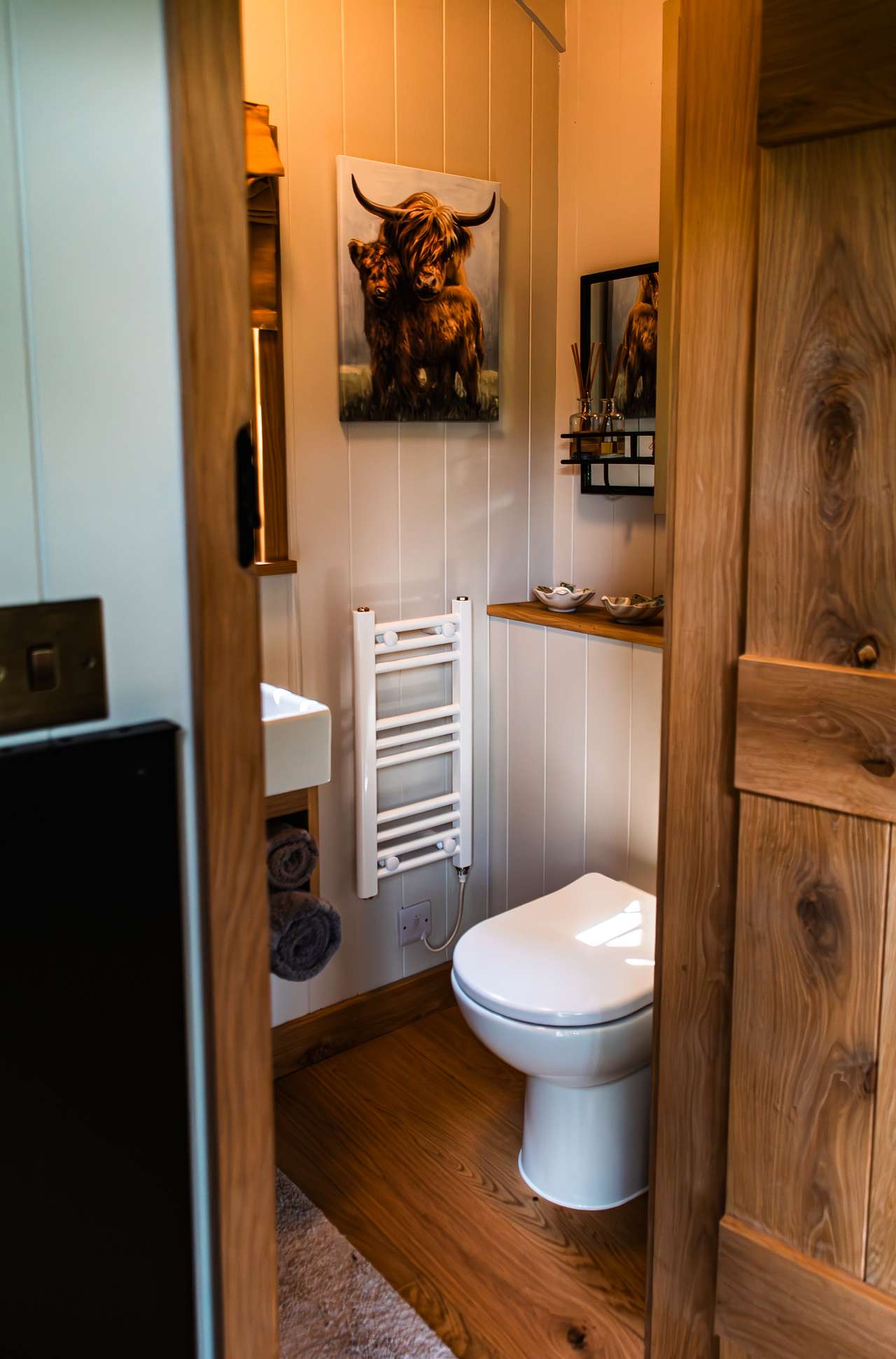 The well equipped bathroom with heated towel rail.