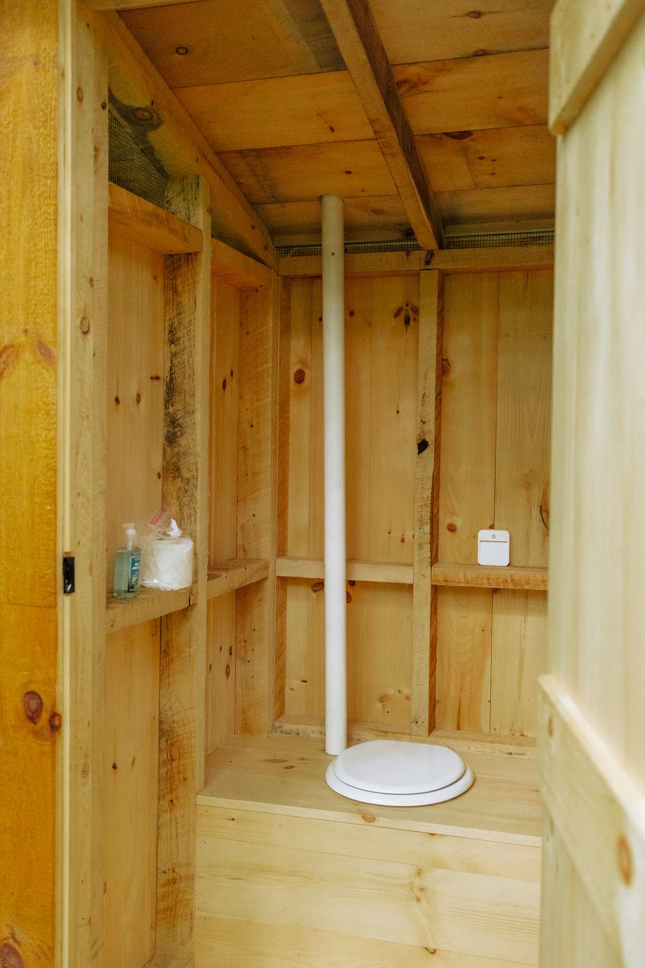 The outhouse is near when you park before you walk the trail to your cabin. 